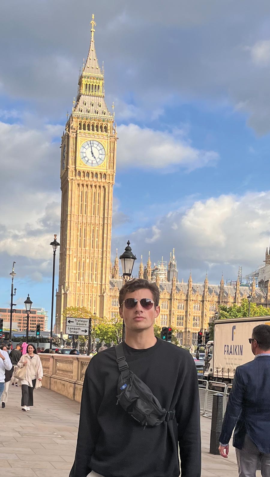 Clint Johnson in front of Big Ben, a clock tower, in London
