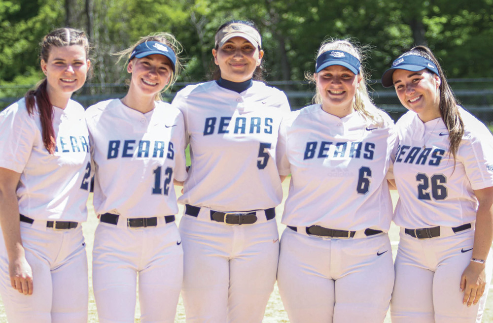 five members of the St. Joseph's Brooklyn Campus softball team in uniform