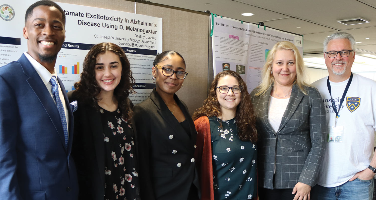 St. Joseph’s University undergraduate students smile for a group photo at the spring Student Research Symposium