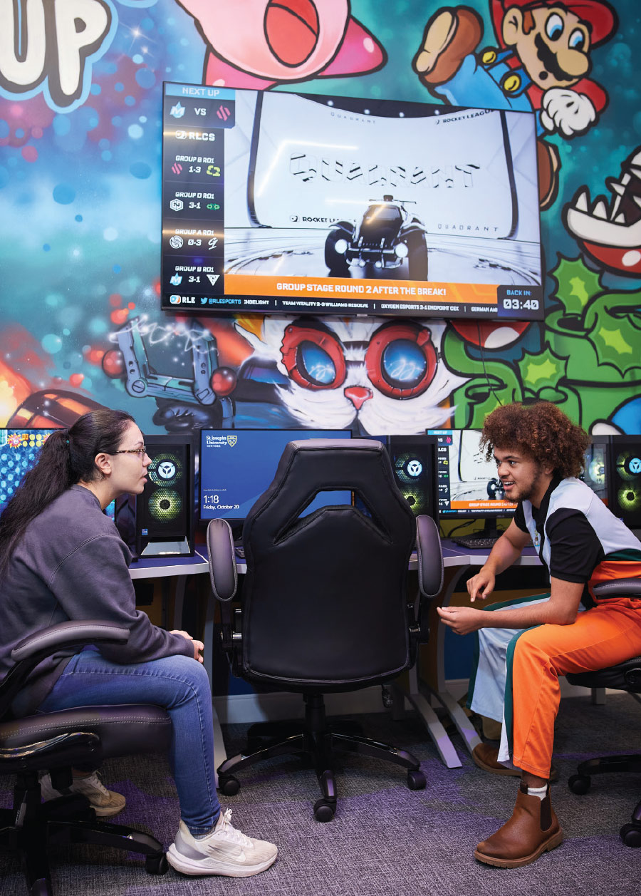 students sitting in SJNY’s state-of-the-art esports lounge