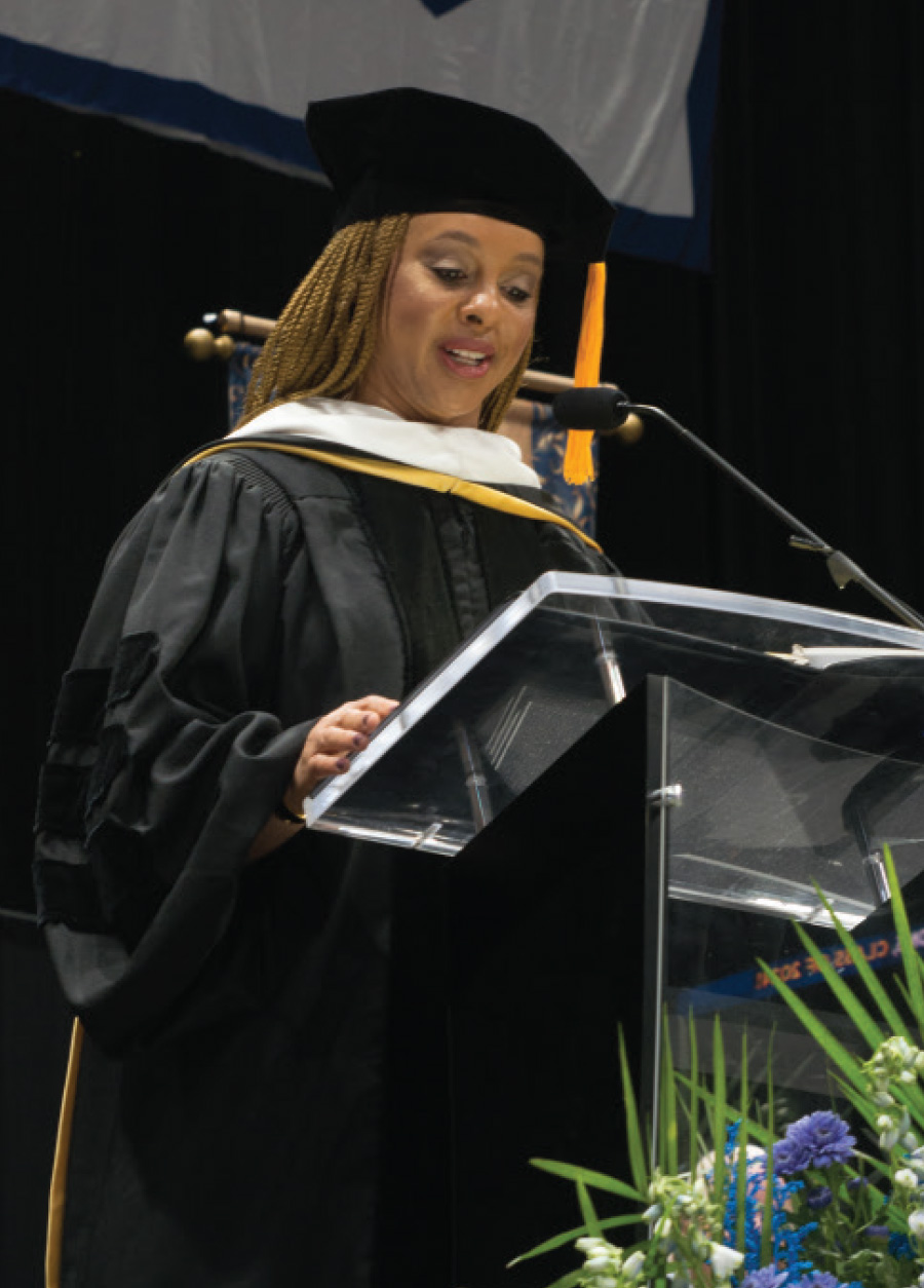 Dr. KMarie King speaking at podium