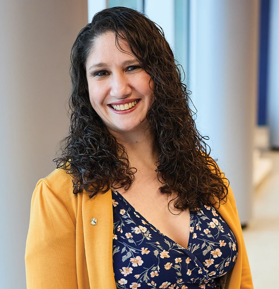 Lisa Galasso-Werner smiling in a hallway