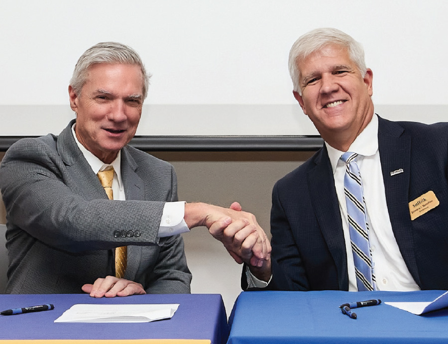 SJNY President Dr. Donald R. Boomgaarden and SCCC President Dr. Edward T. Bonahue shaking hands