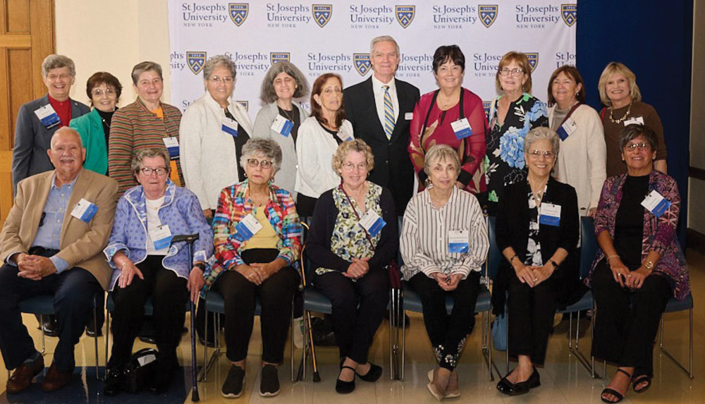 SJNY Class of 1974 posing together at a celebration