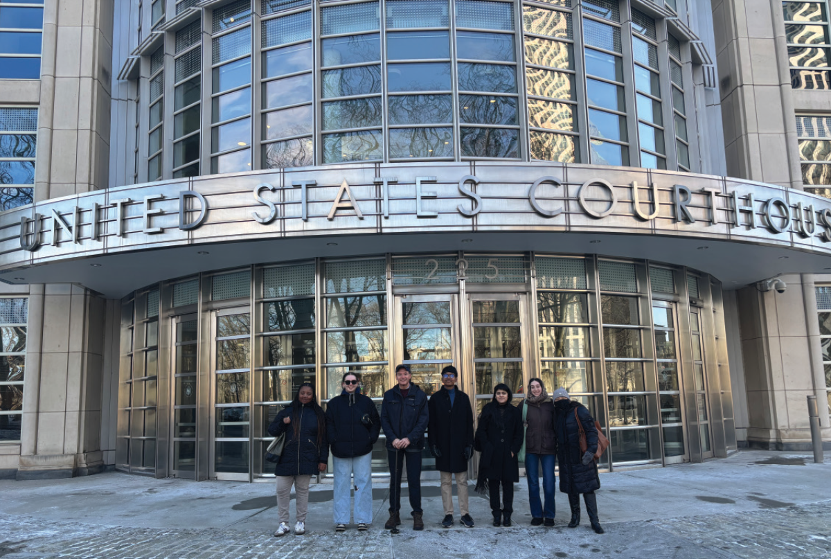 SJNY students visited a United States Courthouse building to meet judges and sit in on naturalization ceremonies; Pictured here are these SJNY students standing together for a group photo outside a United States Courthouse building entrance