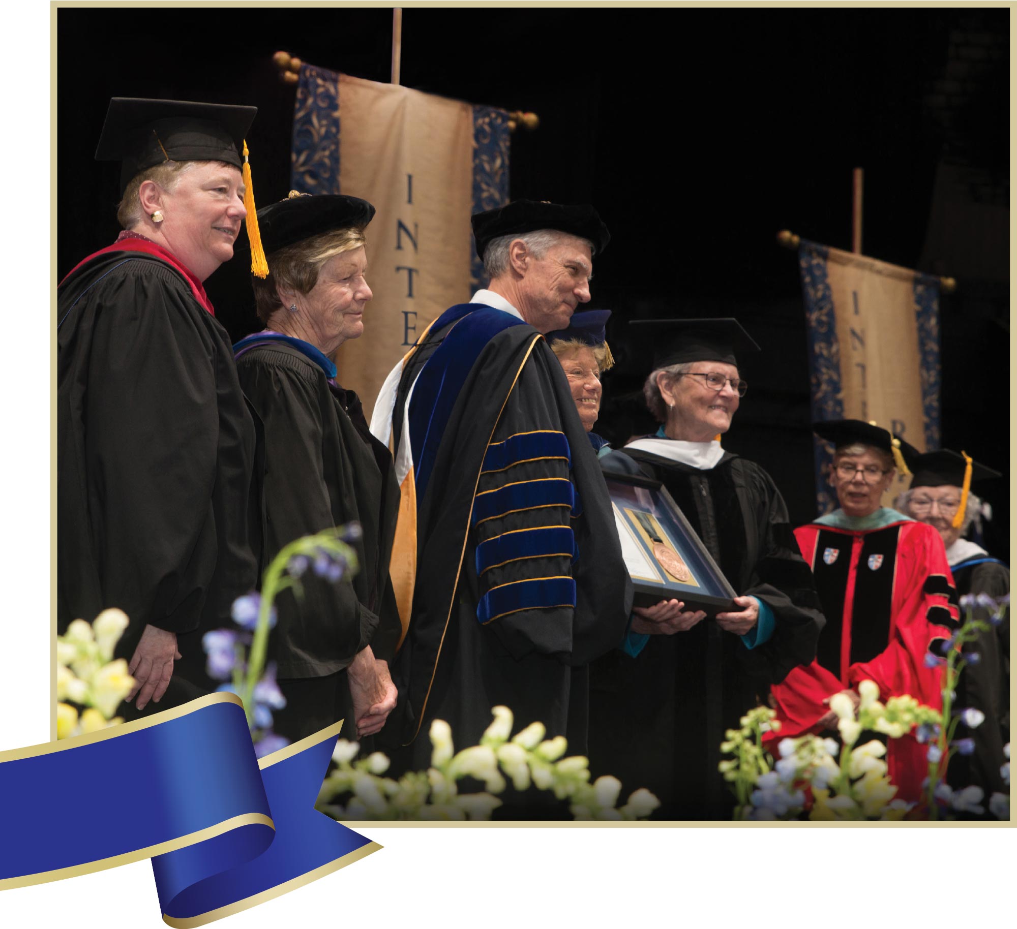 Dean with the Sisters of St. Joseph in caps and gowns