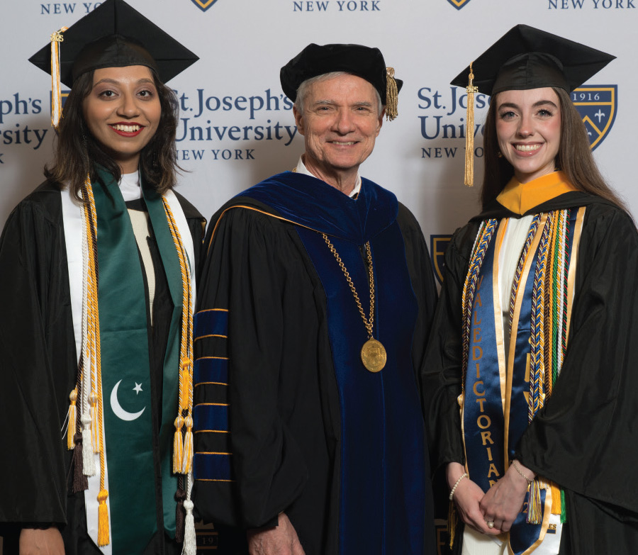dean with two female graduates